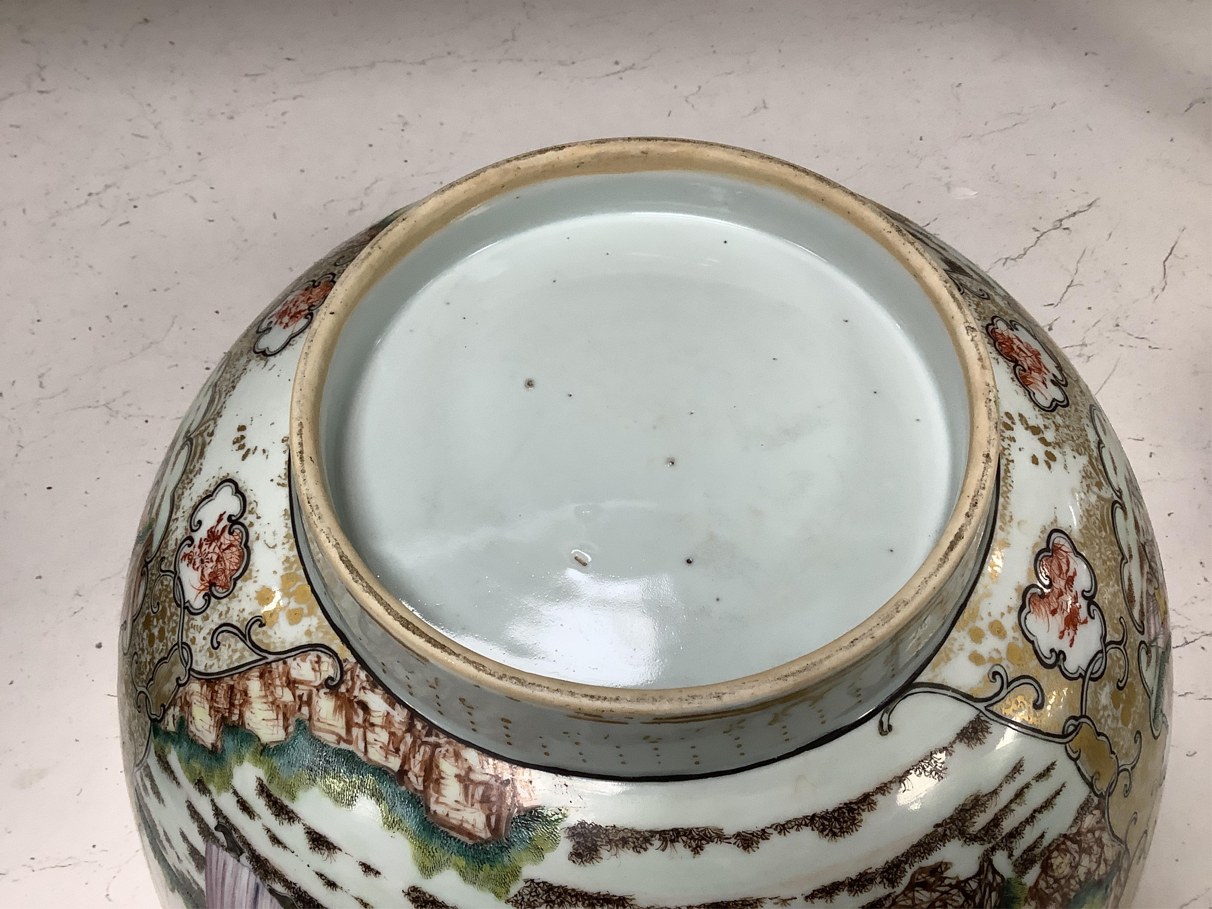 An 18th century Chinese famille rose figural bowl, on wooden stand, 34cm diameter.